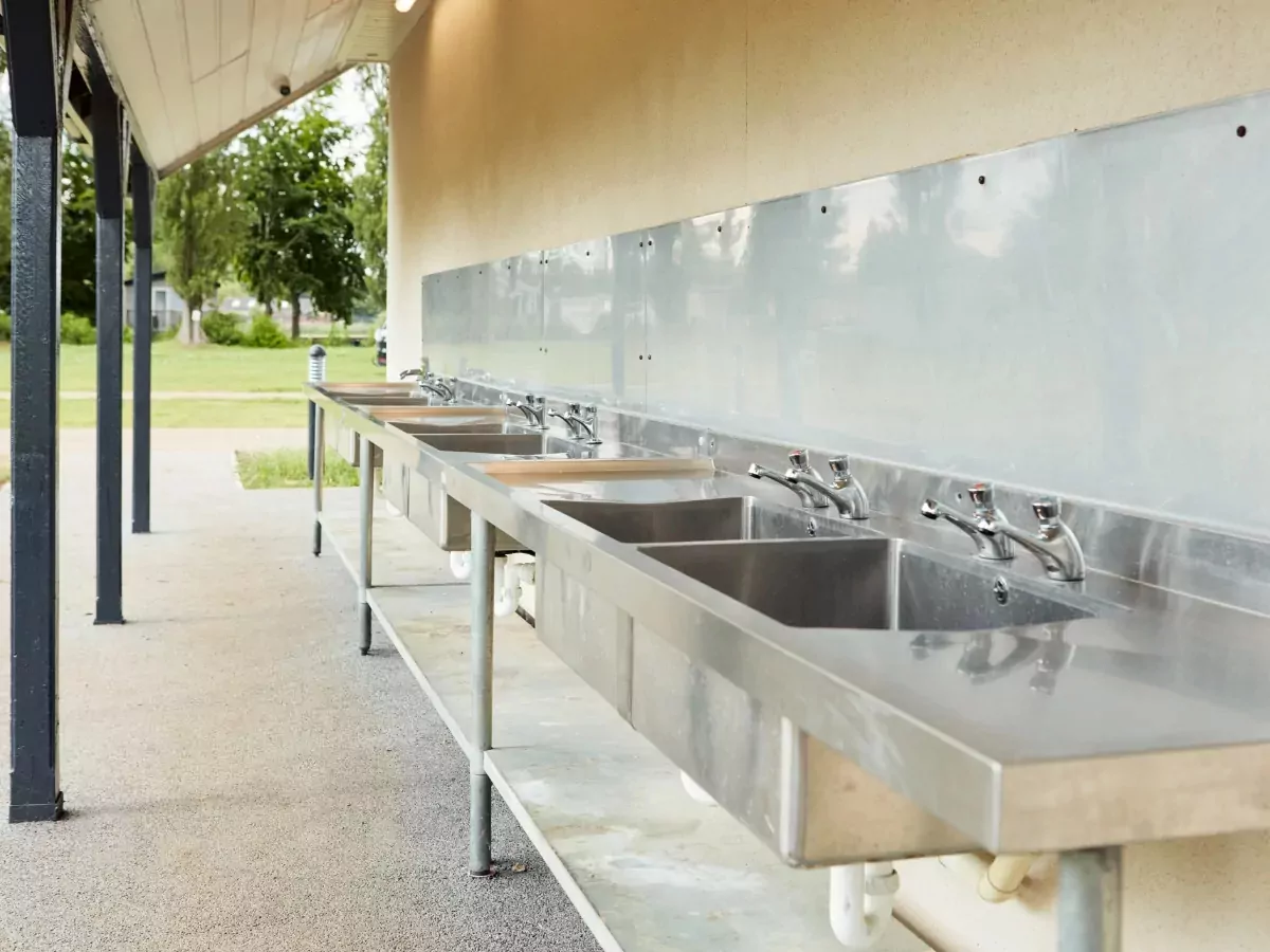 Outdoor stainless steel washing up sinks available for guests at the holiday park facilities at Billing Aquadrome.