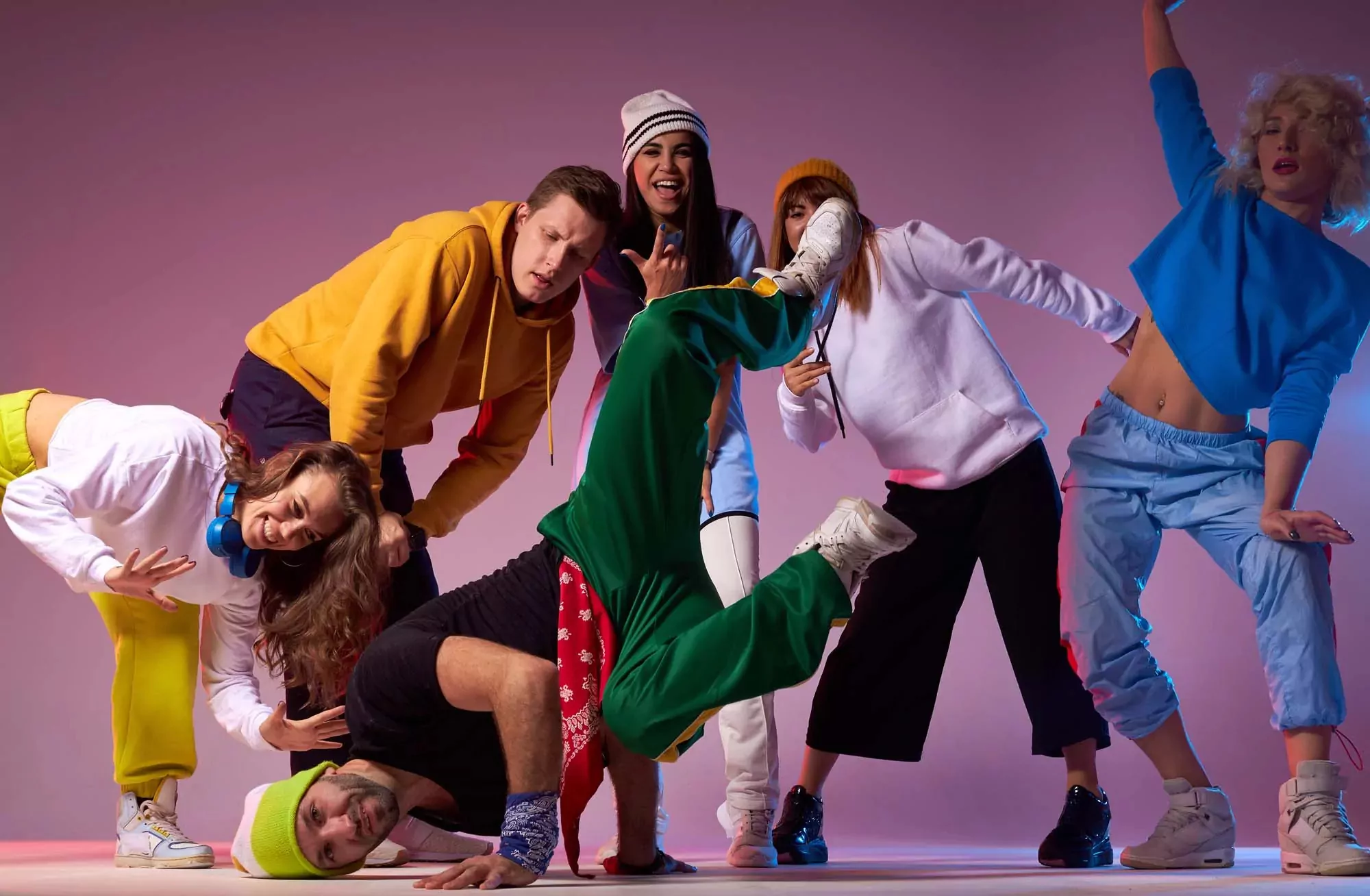 Group of people having fun and performing energetic dance moves at Billing Aquadrome