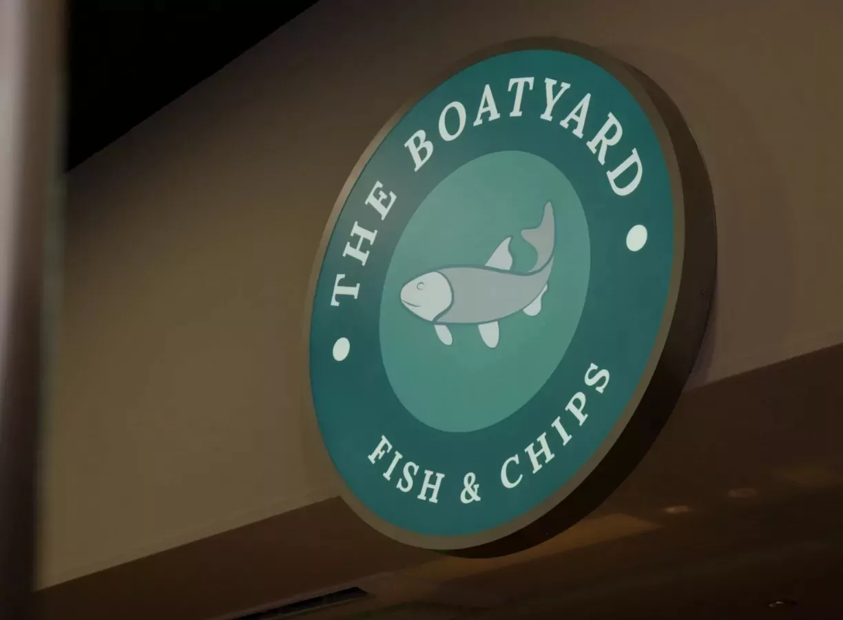 Illuminated sign for The Boatyard Fish and Chips restaurant at Billing Aquadrome.