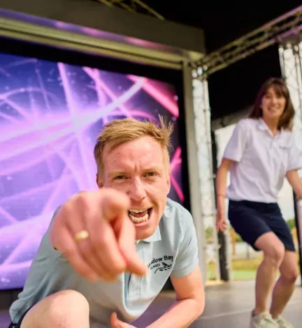 Entertainers on stage hyping up the crowd during a live show at Billing Aquadrome holiday park