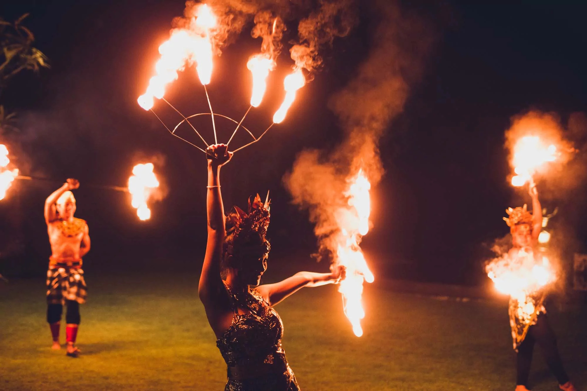 Fire dancers performing under the night sky at Meadow Bay Villages – a thrilling and visually stunning part of the evening entertainment lineup.