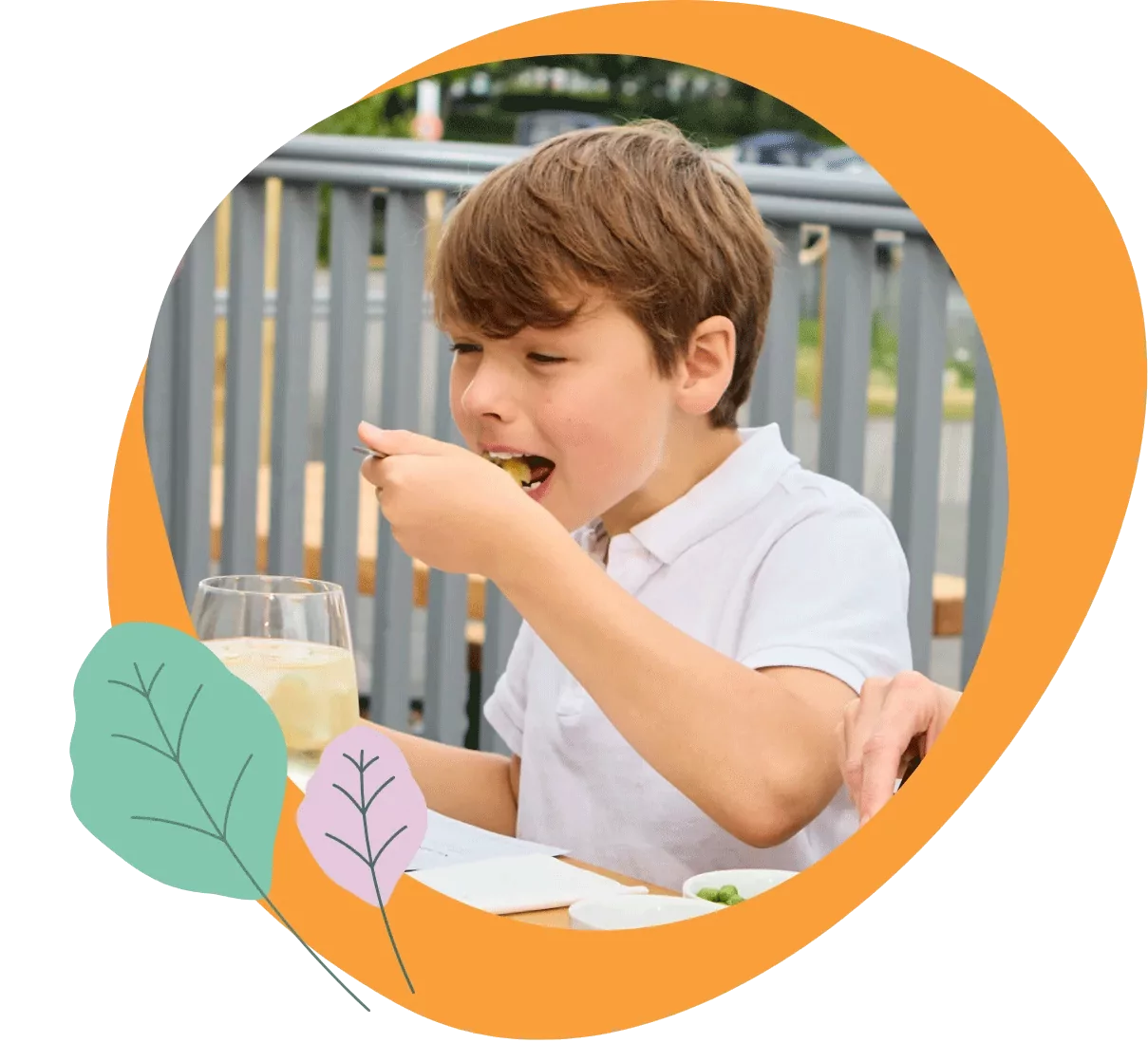 Young boy enjoying a meal outdoors at Meadow Bay Villages – showcasing the family-friendly dining experience available across the holiday parks.