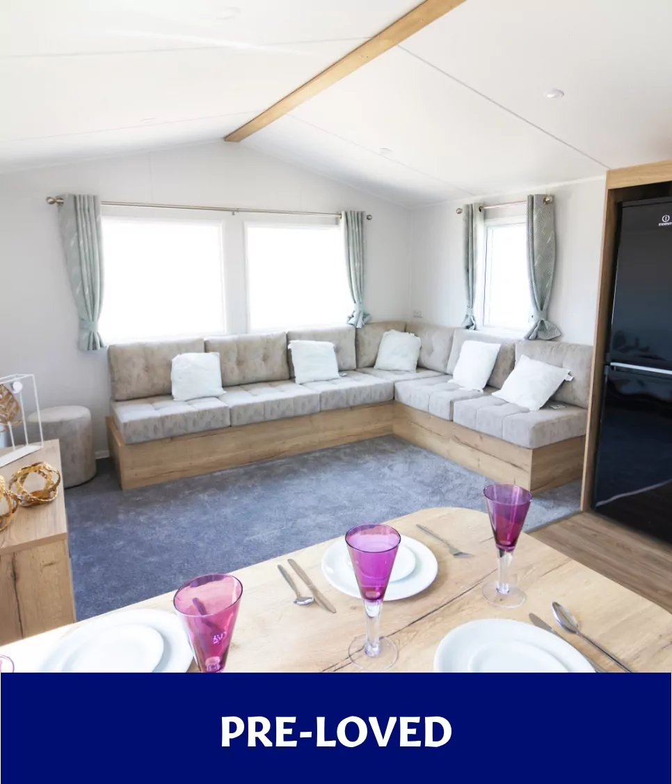Pre-loved holiday home with large corner sofa and dining table set at Billing Aquadrome.