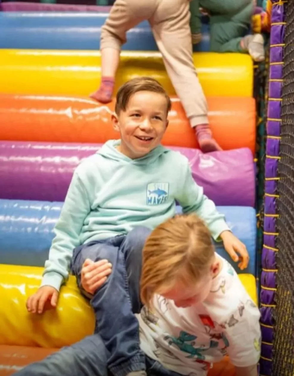 Children climbing and playing on the colourful indoor soft play area at Billing Aquadrome.