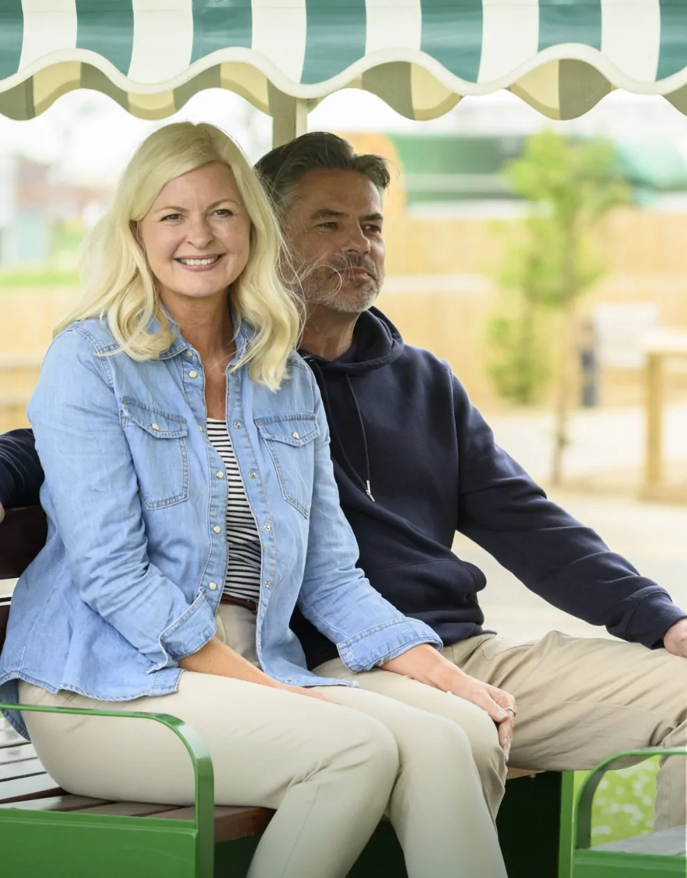 Couple smiling while riding on the outdoor land train at Billing Aquadrome.