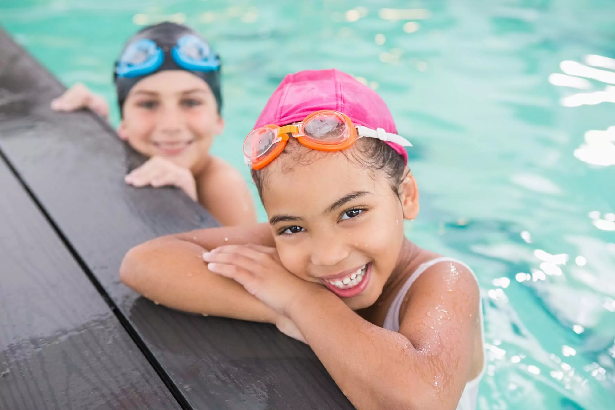 Smiling children enjoying a swim in the indoor pool at Golden Leas.