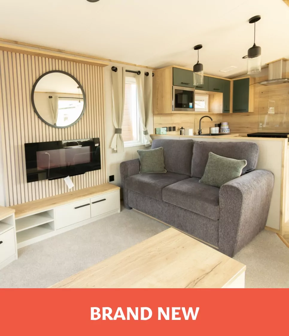 Modern living room and kitchen in a brand new holiday home for sale at Golden Leas