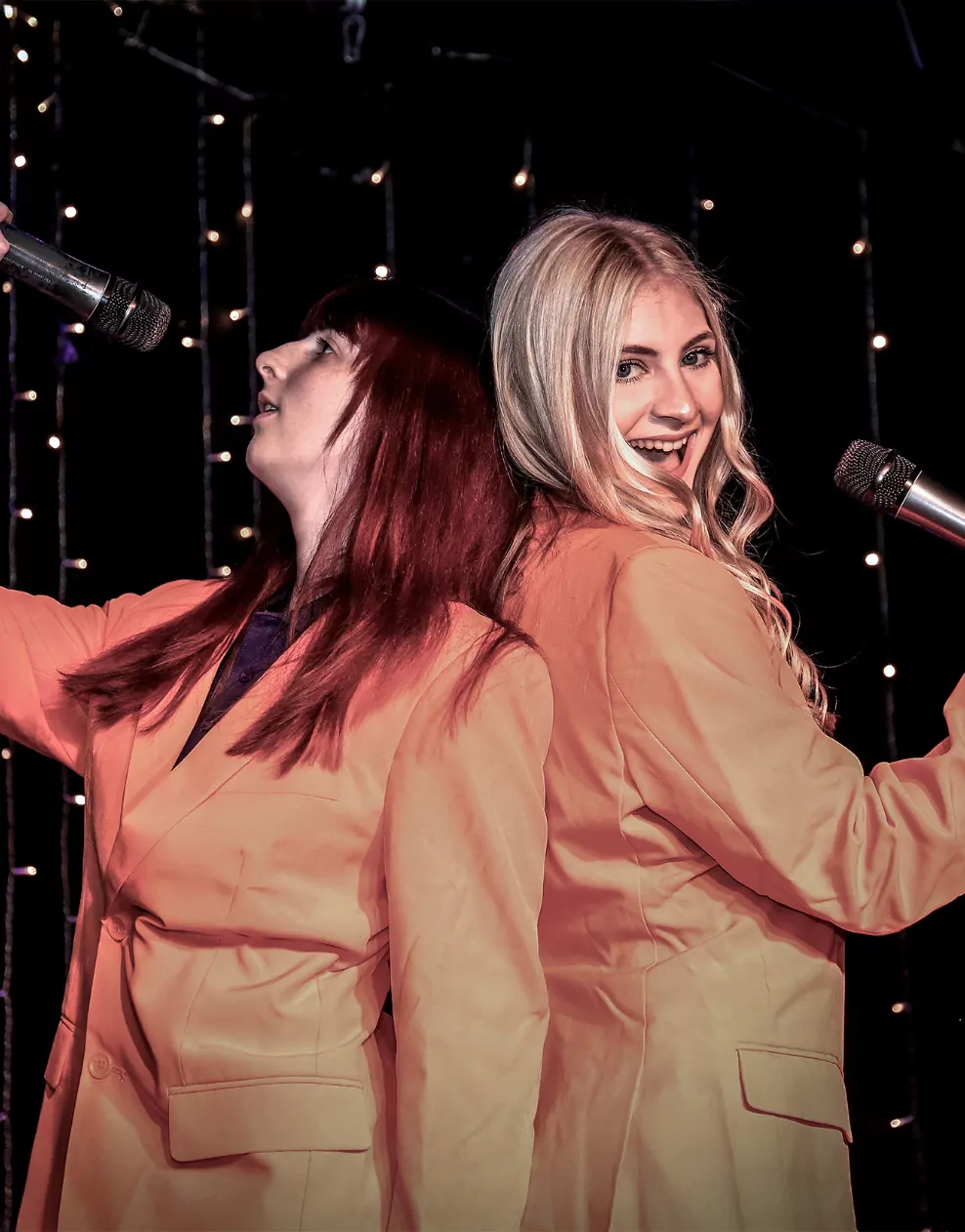 Two entertainers in orange suits.