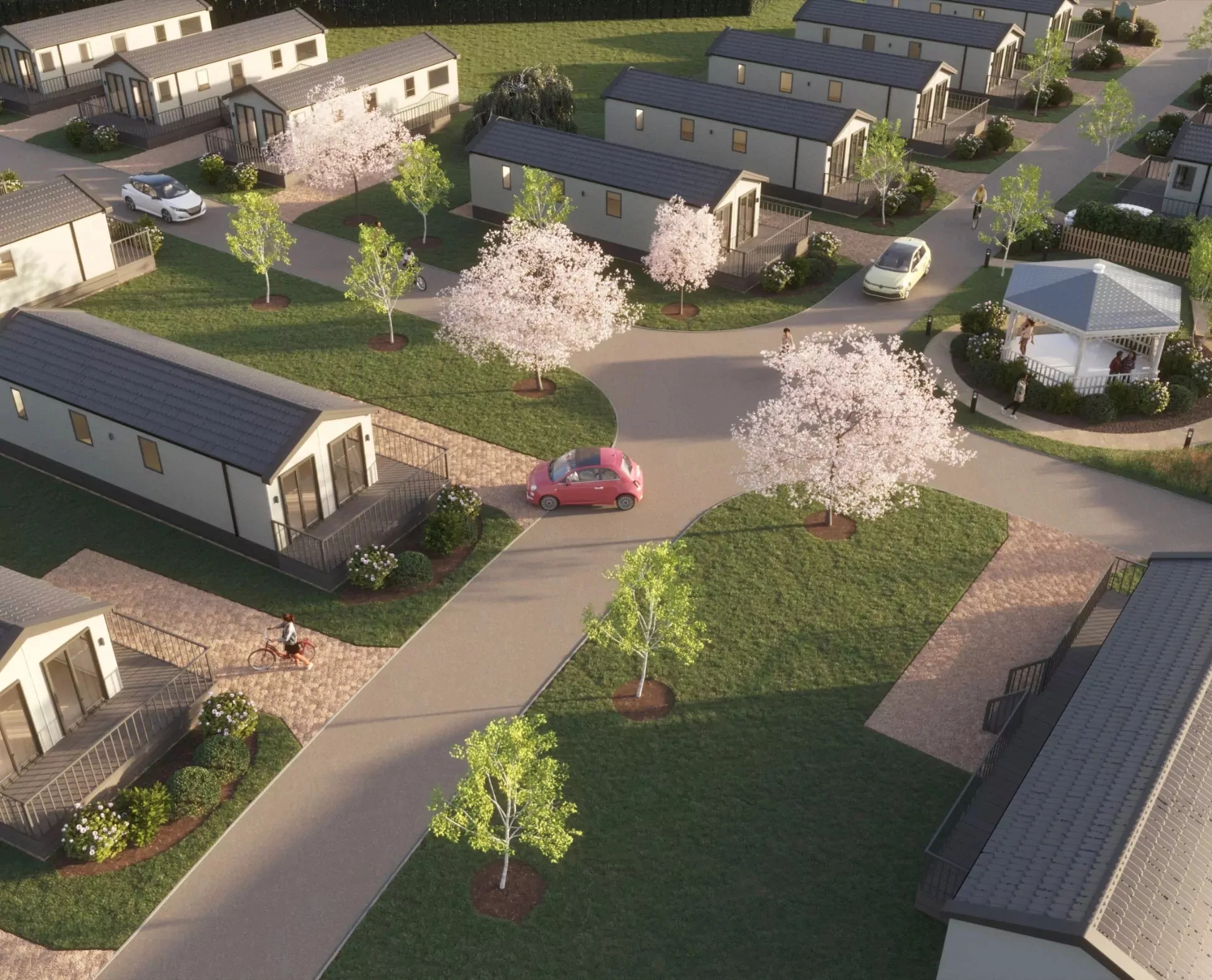 An aerial view of a modern holiday park featuring static caravans, roads, and blossoming trees Hayling Island