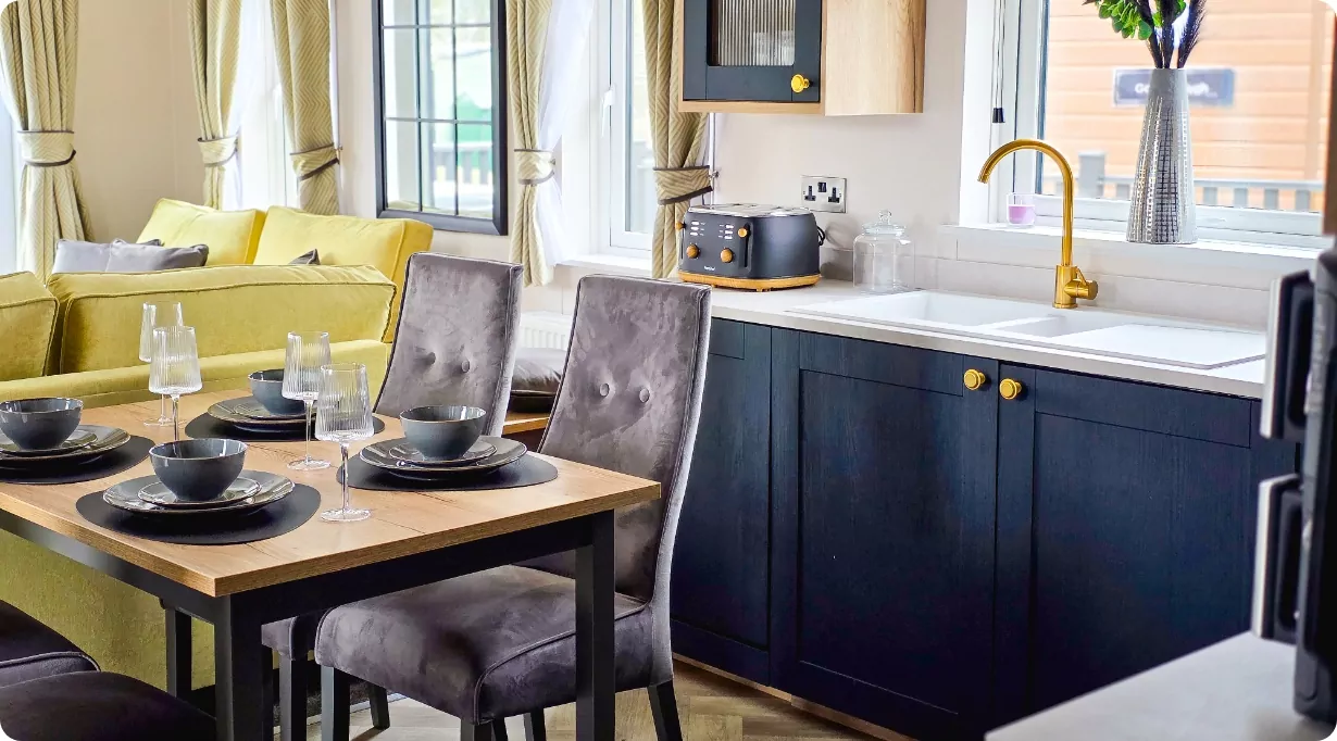 A shot of the modern dining and kitchen area inside a Platinum-grade holiday caravan at Hayling Island.