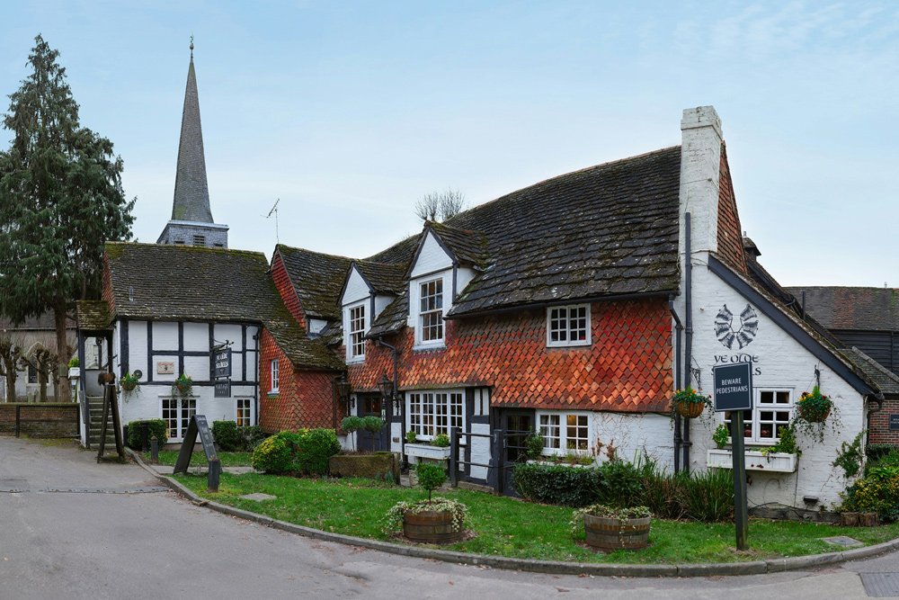 Picturesque half-timbered cottages in the historic village of Shere, located close to Henfold Lakes.