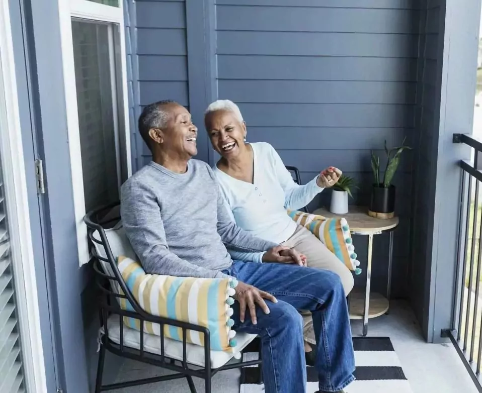 Smiling couple enjoying affordable holiday home ownership at Hollybush farm