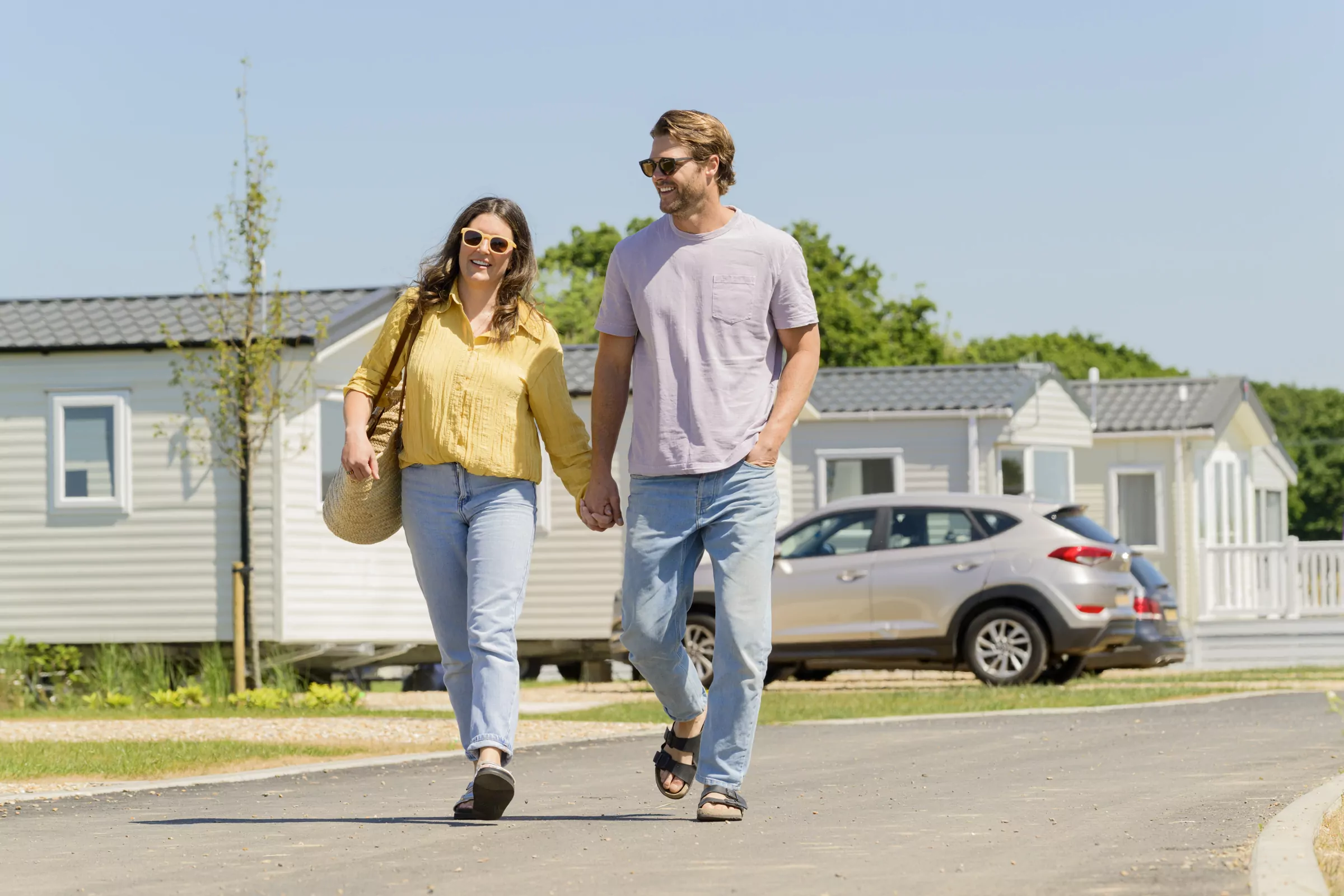 Couple walking to the beach at Hayling Island