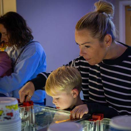 Volunteers working with compost and mulch in a sustainable gardening effort to support local green initiatives.