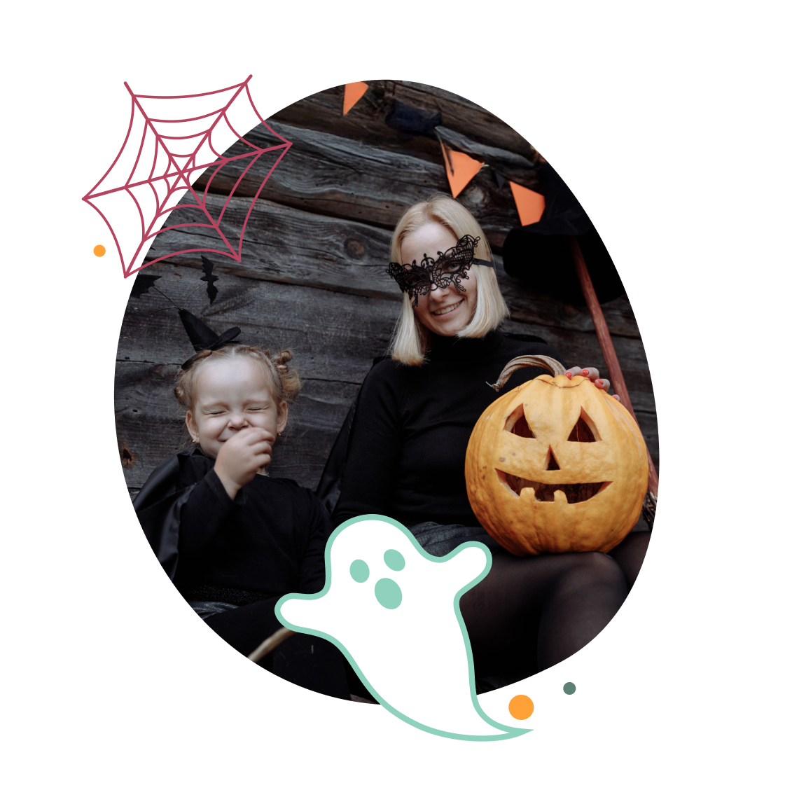 A mother and young child in Halloween costumes posing with a carved jack-o'-lantern pumpkin during seasonal activities at Meadow Bay Villages