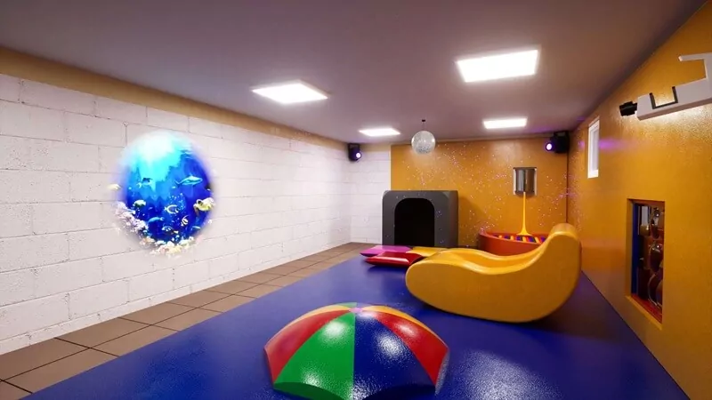 A room with a projected image of a fish tank on the wall