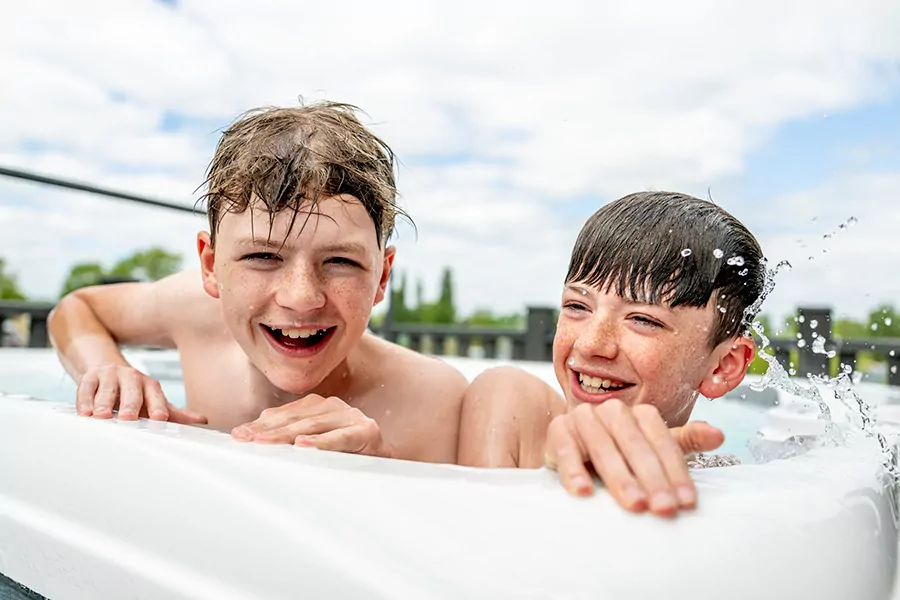 Two boys enjoying a hot tub at Billing Aquadrome Holiday Park