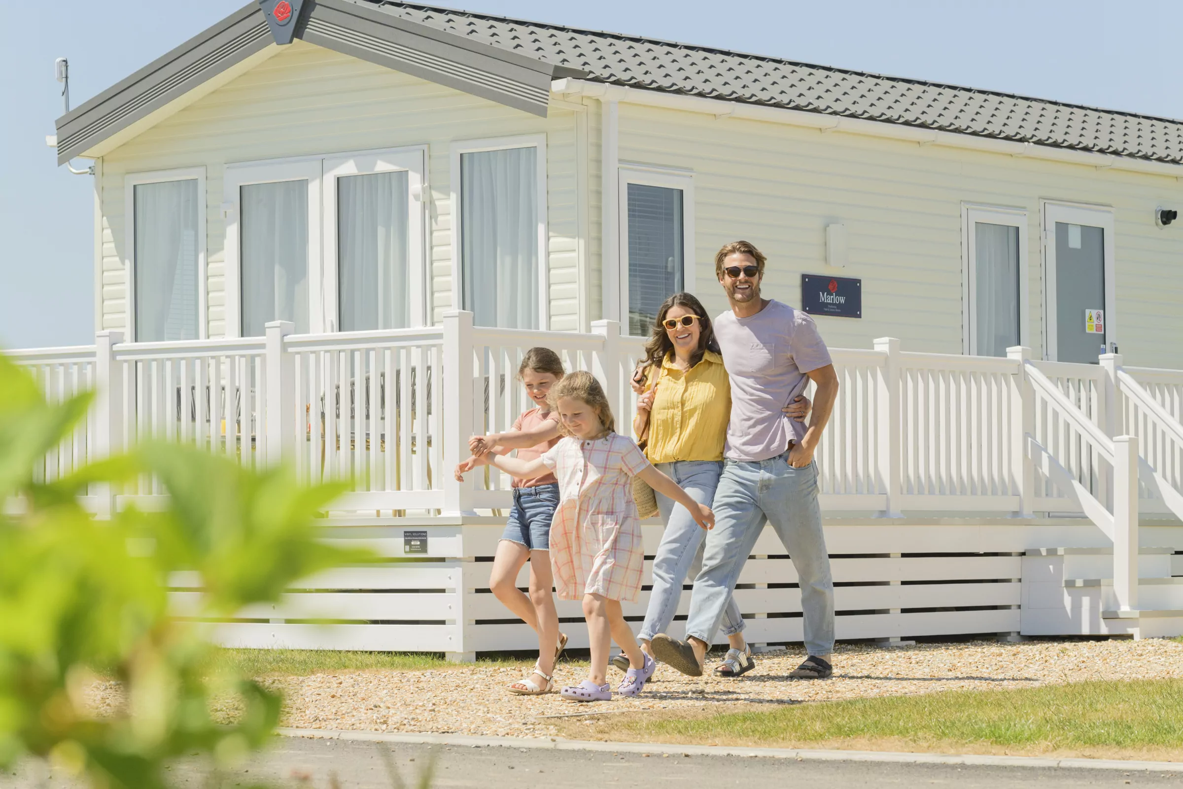 family enjoying a caravan break at meadow bay villages