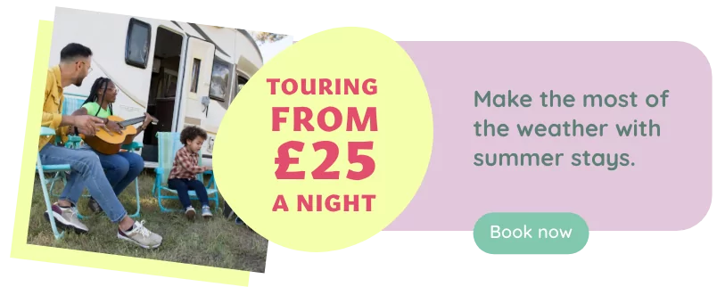 Family playing the guitar outside their caravan, with price promotion 'Touring from £25 a night'